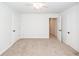 Spacious carpeted bedroom with white walls, a ceiling fan and closet at 123 White Picket Ln, Summerville, SC 29483
