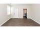 Bedroom featuring wood floors, window and a door leading to the en suite bathroom at 123 White Picket Ln, Summerville, SC 29483