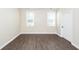 Bedroom featuring wood floors and two windows allowing lots of natural light to shine in at 123 White Picket Ln, Summerville, SC 29483