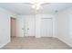 Comfortable bedroom with a ceiling fan, closet and multiple doorways at 123 White Picket Ln, Summerville, SC 29483