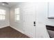 Bright entryway featuring wood-look flooring, white walls, and a solid white door at 123 White Picket Ln, Summerville, SC 29483