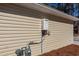 An exterior shot of the side of the house with a modern water heater system at 123 White Picket Ln, Summerville, SC 29483