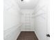 Walk-in closet featuring wire shelving and dark wood floors at 123 White Picket Ln, Summerville, SC 29483