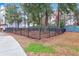 Community backyard enclosed by a metal fence at 1241 Allusion Ln, Mount Pleasant, SC 29466