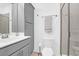 Clean bathroom features a cabinet, toilet, mirror, and glass door shower at 1241 Allusion Ln, Mount Pleasant, SC 29466