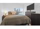 Comfortable bedroom featuring a large window and an oversized television mounted on the wall at 1241 Allusion Ln, Mount Pleasant, SC 29466