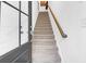 Bright entryway featuring a staircase with carpeted steps and a wooden handrail at 1241 Allusion Ln, Mount Pleasant, SC 29466