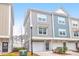 Charming two-story townhome with attached one car garage and colorful exterior design at 1241 Allusion Ln, Mount Pleasant, SC 29466
