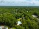 Community aerial view showing mature trees, a sparkling pool, clubhouse and green space at 129 Isherwood Dr, Goose Creek, SC 29445