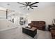 Spacious living room with tile flooring, leather sofas, and an open floor plan leading to the kitchen at 129 Isherwood Dr, Goose Creek, SC 29445