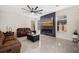 Cozy living room features tile floors, a ceiling fan, comfortable leather sofas, and a modern electric fireplace at 129 Isherwood Dr, Goose Creek, SC 29445
