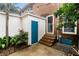 Backyard featuring a brick stairway, and a white fence with foliage around it at 133 Wentworth St, Charleston, SC 29401