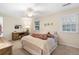 Inviting bedroom with carpet floors, ceiling fan and desk at 133 Wentworth St, Charleston, SC 29401