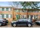 Charming brick townhomes with colorful shutters and well-maintained landscaping at 133 Wentworth St, Charleston, SC 29401