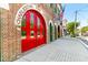 Historic fire station building with prominent red doors, brick facade, and vintage charm at 133 Wentworth St, Charleston, SC 29401
