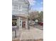Charming corner building with a welcoming entrance, outdoor seating, and street parking at 133 Wentworth St, Charleston, SC 29401