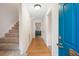 Foyer with stairs and a bright blue front door at 133 Wentworth St, Charleston, SC 29401