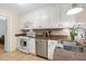 Functional kitchen with white appliances, granite countertops, and ample cabinet space, providing a practical cooking environment at 133 Wentworth St, Charleston, SC 29401