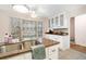 Bright kitchen showcasing stainless steel appliances, granite countertops, and white cabinets, designed for modern cooking needs at 133 Wentworth St, Charleston, SC 29401