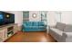 Inviting living room featuring hardwood floors, neutral walls, and comfortable seating, perfect for relaxation and entertainment at 133 Wentworth St, Charleston, SC 29401