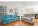 Comfortable living room with hardwood floors, white walls, and cozy couches, creating an inviting and relaxing atmosphere at 133 Wentworth St, Charleston, SC 29401
