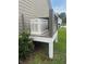Exterior view of a home generator with a white finish and protective enclosure, ensuring power during outages at 1502 Checker Ct, Mount Pleasant, SC 29466