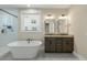 Stylish bathroom featuring a tub, shower, patterned tile floor, and dual vanity at 1502 Checker Ct, Mount Pleasant, SC 29466