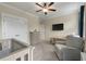 Comfortable bedroom featuring a cozy chair, large closet, and an accent wall at 1502 Checker Ct, Mount Pleasant, SC 29466