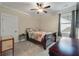 Bedroom with a patterned bedspread, two windows, and an interesting side table at 1502 Checker Ct, Mount Pleasant, SC 29466