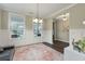 A lovely dining area boasts wainscoting and multiple windows for natural light at 1502 Checker Ct, Mount Pleasant, SC 29466