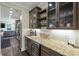 A bar area with wooden cabinets, a wine cooler, and stainless steel appliances at 1502 Checker Ct, Mount Pleasant, SC 29466