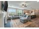 Bright living space with a sectional sofa, fireplace, open to the kitchen with island seating at 1502 Checker Ct, Mount Pleasant, SC 29466