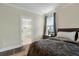 Comfortable main bedroom showcasing an ensuite bathroom with tile floors at 1502 Checker Ct, Mount Pleasant, SC 29466
