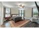 Comfortable main bedroom with a ceiling fan, windows and a luxurious area rug at 1502 Checker Ct, Mount Pleasant, SC 29466