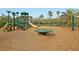 Community playground featuring modern equipment, a soft landing surface, and surrounding mature landscaping at 1502 Checker Ct, Mount Pleasant, SC 29466