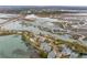 Expansive aerial view of waterfront homes with a private pool and picturesque marshlands, highlighting the serene location at 1607 Folly Creek Way Way # C-5, Charleston, SC 29412