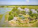 Overhead view of waterfront community featuring a pond with a fountain and beautiful homes at 1607 Folly Creek Way Way # C-5, Charleston, SC 29412