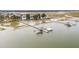 Aerial view of waterfront community with private docks, offering stunning marsh views and coastal living at 1607 Folly Creek Way Way # C-5, Charleston, SC 29412