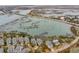 Captivating aerial view of waterfront homes near a bridge, complemented by scenic marshlands and coastal views at 1607 Folly Creek Way Way # C-5, Charleston, SC 29412