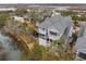 Aerial view of a home with multiple screened porches overlooking scenic waterways at 1607 Folly Creek Way Way # C-5, Charleston, SC 29412