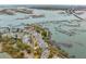Stunning aerial view of waterfront homes nestled along the marsh with private docks and scenic surroundings at 1607 Folly Creek Way Way # C-5, Charleston, SC 29412