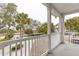 This balcony offers an outdoor space to relax and enjoy views of palm trees and neighborhood at 1607 Folly Creek Way Way # C-5, Charleston, SC 29412
