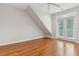 Bright bedroom with hardwood floors and access to a balcony at 1607 Folly Creek Way Way # C-5, Charleston, SC 29412