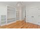Spacious bedroom with wood floors, built-in shelving, and a closet for storage at 1607 Folly Creek Way Way # C-5, Charleston, SC 29412