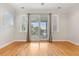 The bedroom features a wall of windows and access to a private balcony with an exceptional view at 1607 Folly Creek Way Way # C-5, Charleston, SC 29412