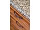 Close-up highlighting the premium wood cabinetry and elegant hardware in the kitchen at 1607 Folly Creek Way Way # C-5, Charleston, SC 29412