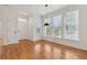 Dining area with hardwood floors, large windows, and modern hanging light fixture at 1607 Folly Creek Way Way # C-5, Charleston, SC 29412