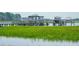 Charming covered dock extending over the marshy water, perfect for boating and enjoying the natural surroundings at 1607 Folly Creek Way Way # C-5, Charleston, SC 29412