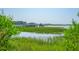Peaceful view of a private dock with a gazebo, offering serene waterfront access and recreational boating opportunities at 1607 Folly Creek Way Way # C-5, Charleston, SC 29412