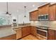 Modern kitchen featuring stainless steel appliances, granite countertops, and custom wood cabinetry at 1607 Folly Creek Way Way # C-5, Charleston, SC 29412